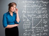 21150548-beautiful-young-school-girl-thinking-about-complex-mathematical-signs